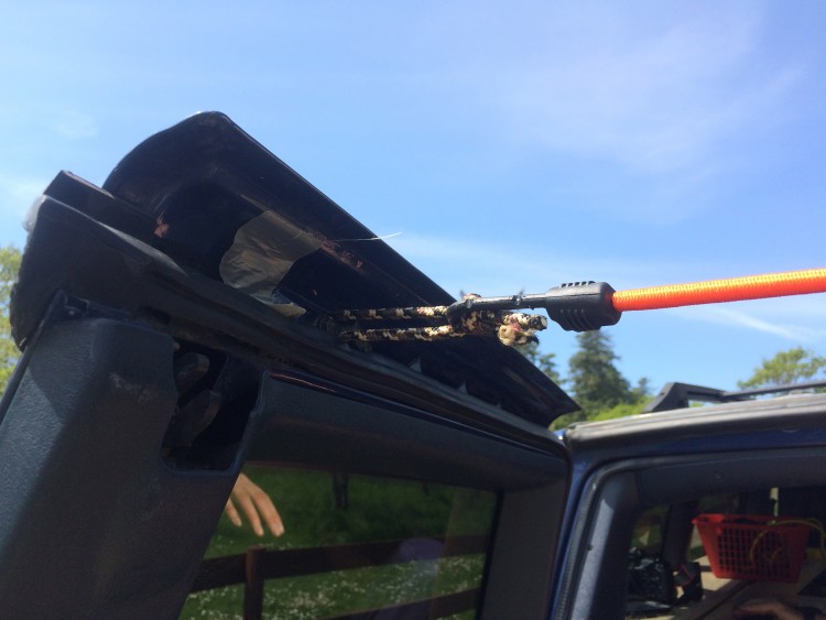 Attaching a bungie cord to rear doors