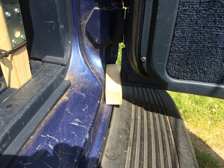 Wooden wedge to stop doors from closing