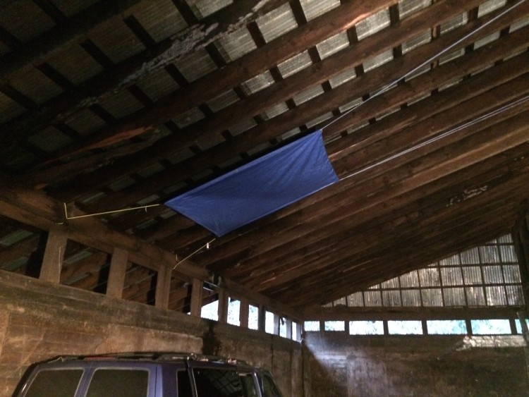 Tarp set up to redirect one of the worst leaks